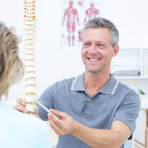 Chiropractic Wildomar CA Doctor Informing Patient